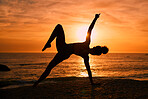 Fitness, yoga and silhouette of woman on beach at sunrise for exercise, training and pilates workout. Motivation, meditation and shadow of girl balance by ocean for sports, wellness and stretching