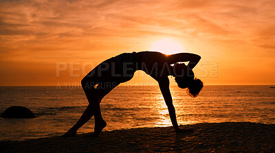 Buy stock photo Balance, yoga and silhouette of woman on beach at sunrise for exercise, training and pilates workout. Fitness, meditation and shadow of girl by ocean for sports, wellness and stretching in morning