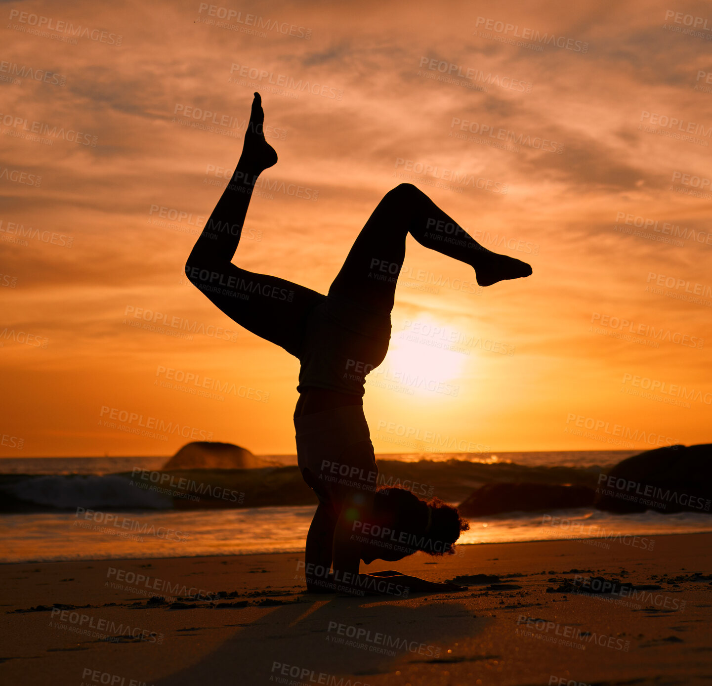 Buy stock photo Yoga, silhouette or handstand on sunset beach, ocean or sea in evening workout or relax exercise training. Yogi, woman or sand balance pose at sunrise for healthcare wellness fitness or strong body