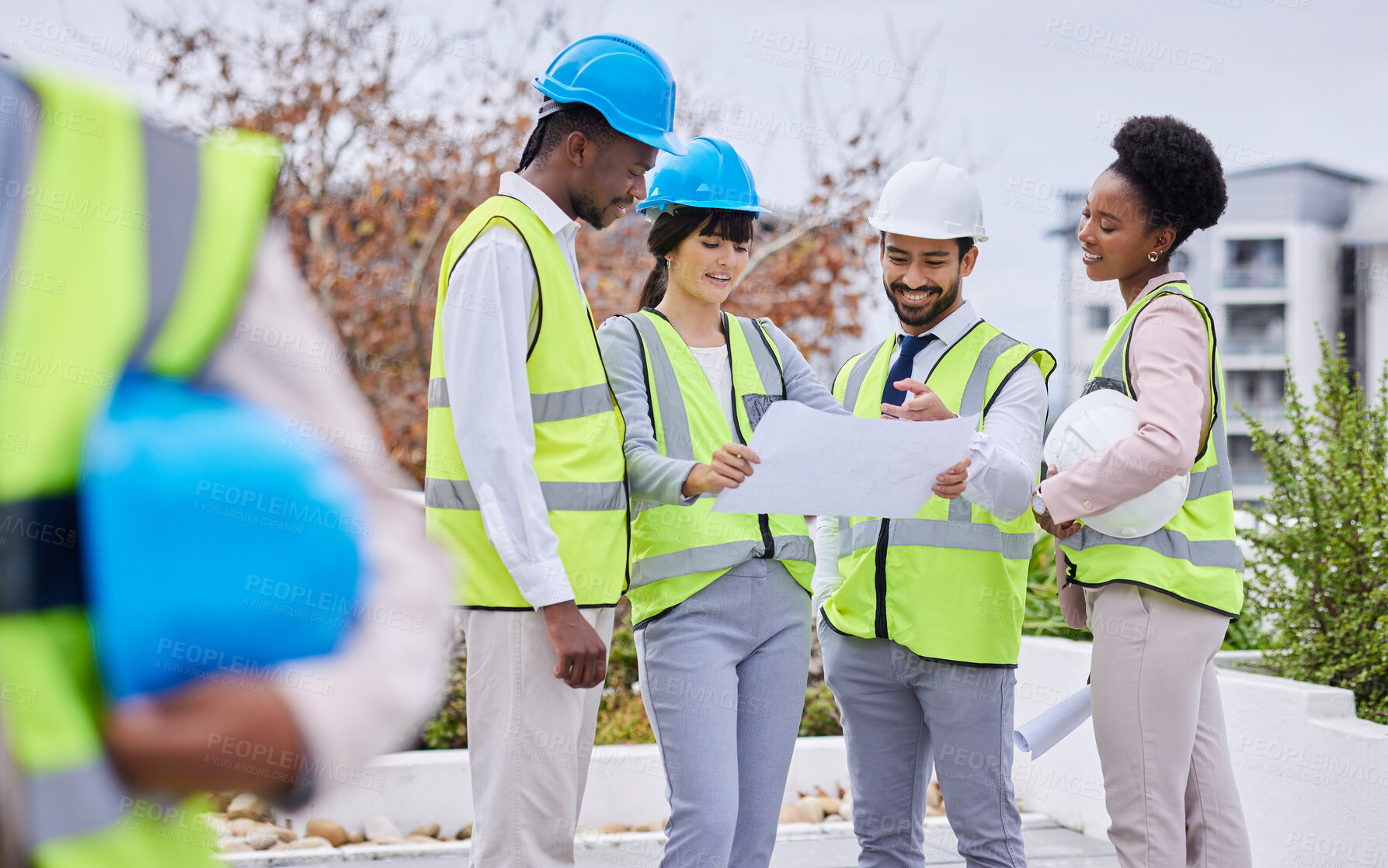 Buy stock photo Architecture, collaboration and blueprint with a designer team working together outdoor on a construction site. Building, design and meeting with an engineer employee group planning together outside