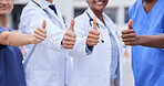 Doctor, thumbs up and medical teamwork with hands, smile or support for healthcare, wellness and mockup. Group, doctors and diversity with yes sign, team building or vision with solidarity for health