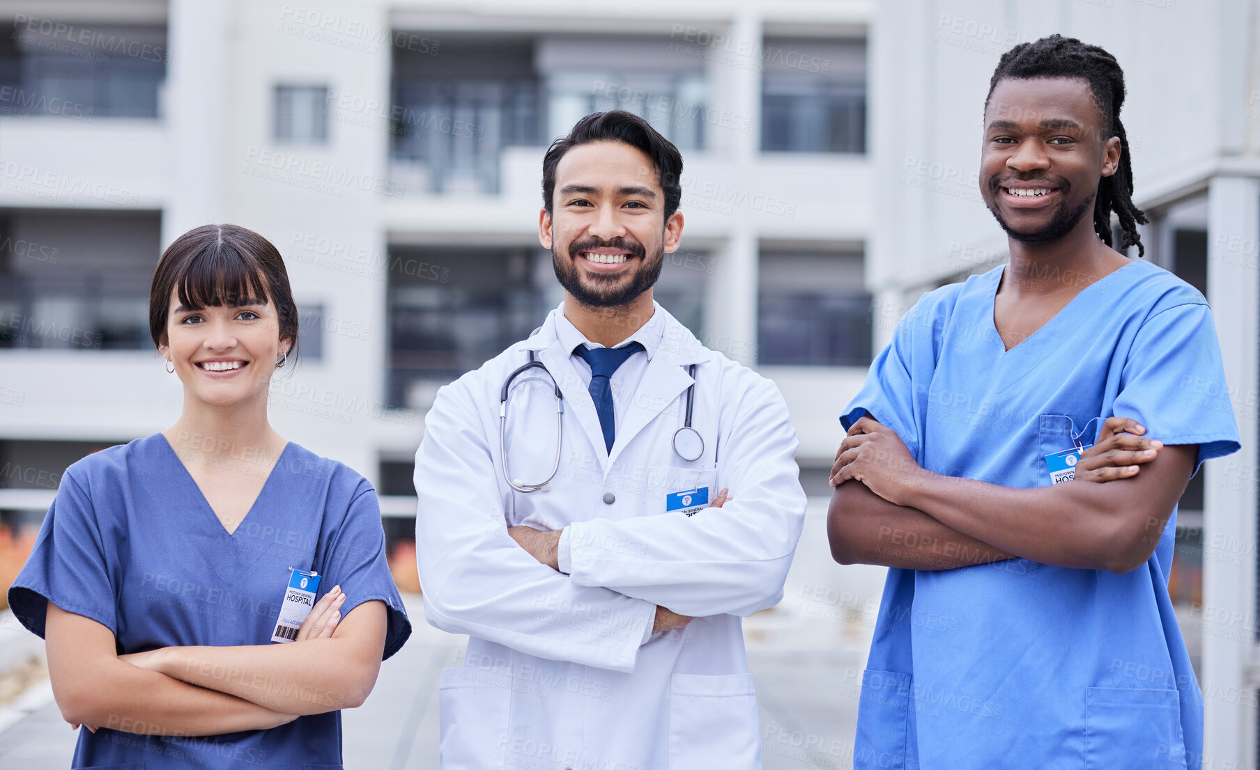 Buy stock photo Portrait, healthcare or collaboration with a doctor and team standing arms crossed outside of a hospital. Medical, teamwork or trust with a man and woman professional medicine group feeling confident