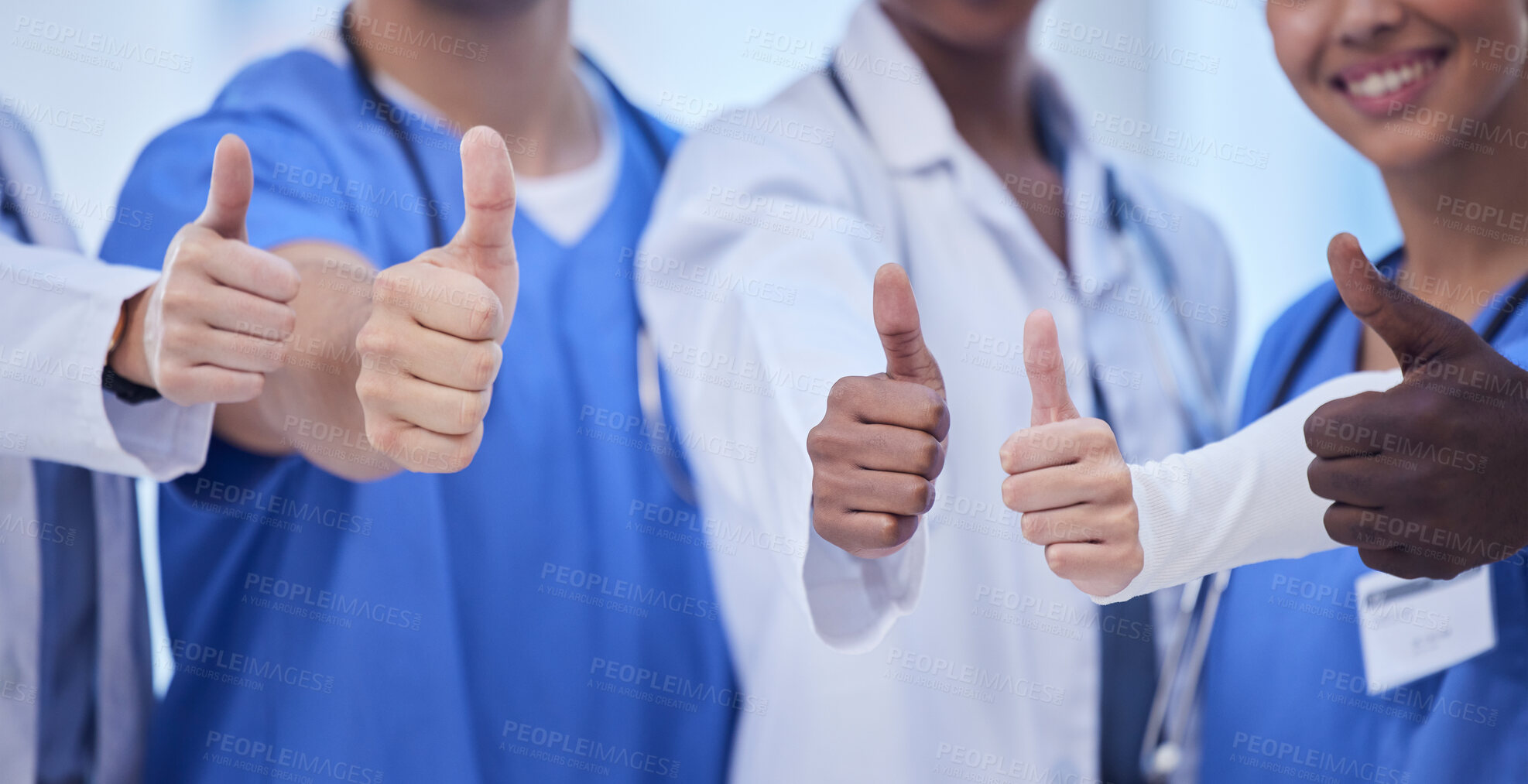 Buy stock photo Healthcare, teamwork and group of doctors with thumbs up, hands together, collaboration and motivation at hospital. Winning, diversity and medical employees in solidarity to help support in medicine.