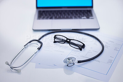Buy stock photo Laptop, stethoscope and medical documents in a office for research, diagnosis or test results. Computer, technology and glasses on a desk for doctor to read healthcare paperwork in hospital or clinic