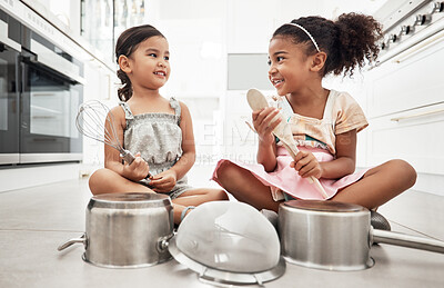 Buy stock photo Girl kids playing house with pots as drums, happy and care free at family home, make believe with music and fun. Noise, metal and children on floor, play date together and fantasy with imagination