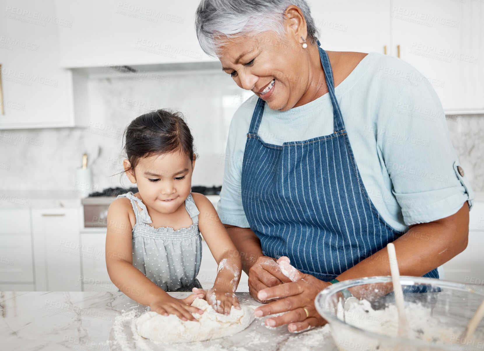 Buy stock photo Love, grandmother and girl baking, learning and happiness on weekend, break and teaching skills. Female kid, old woman or granny with granddaughter in kitchen, dough or bonding with child development