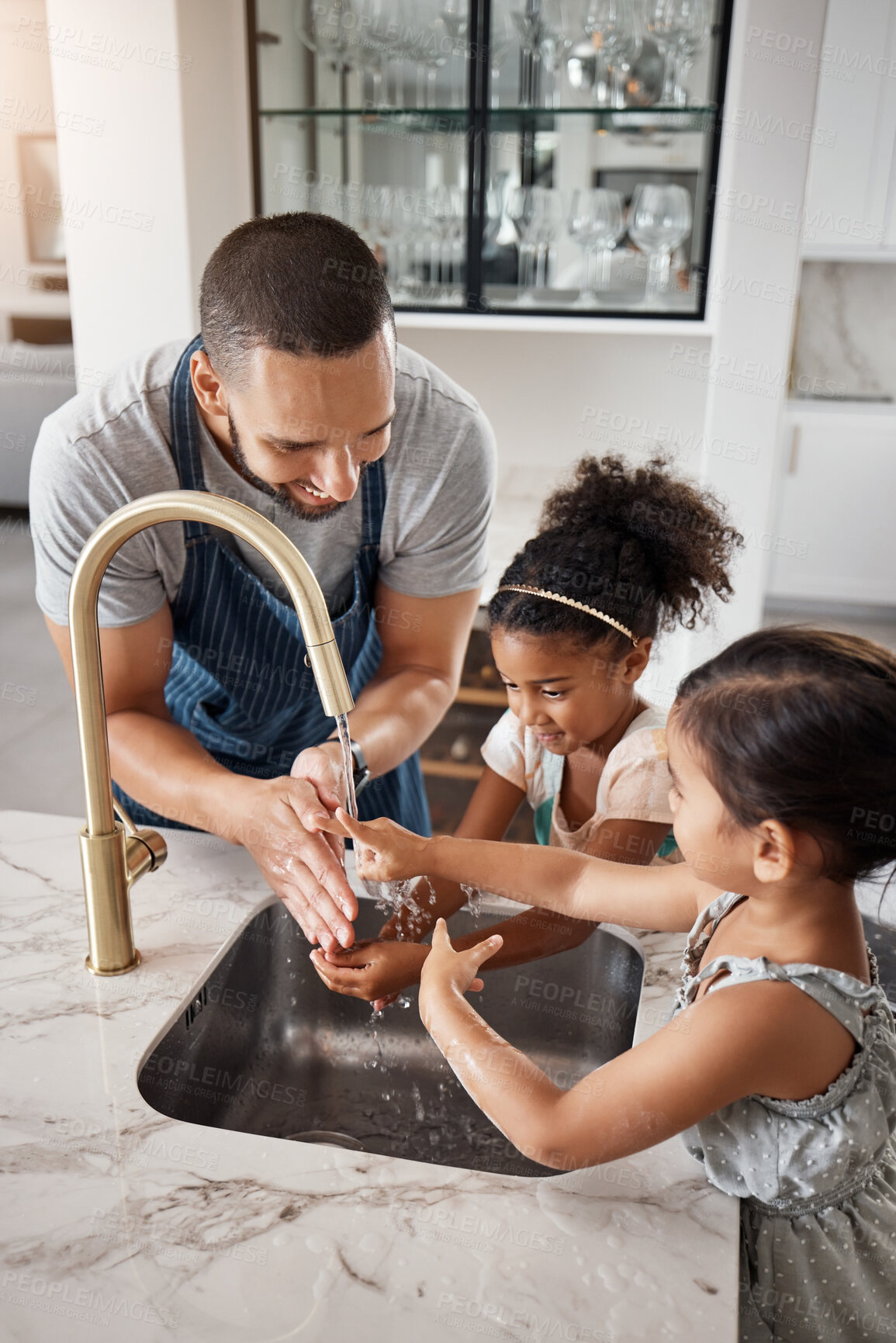 Buy stock photo Love, father and girls washing hands, happiness and bonding together in kitchen, before cooking and hygiene. Family, dad and female children cleaning, happy and teaching kids at home loving and learn