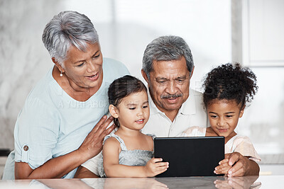 Buy stock photo Learning, grandparents and kids with tablet in home, playing online games or educational app. Bonding, touchscreen or care of happy family watching movie, film or video on digital technology in house