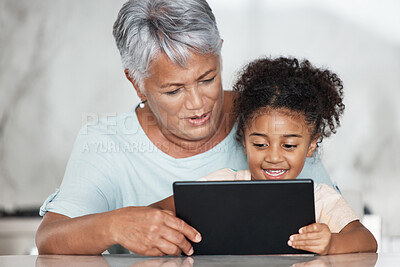 Buy stock photo Grandmother, learning and girl with tablet in home for streaming video, movie or social media. Bonding, touchscreen and care of happy grandma with child watching film or web browsing on technology.