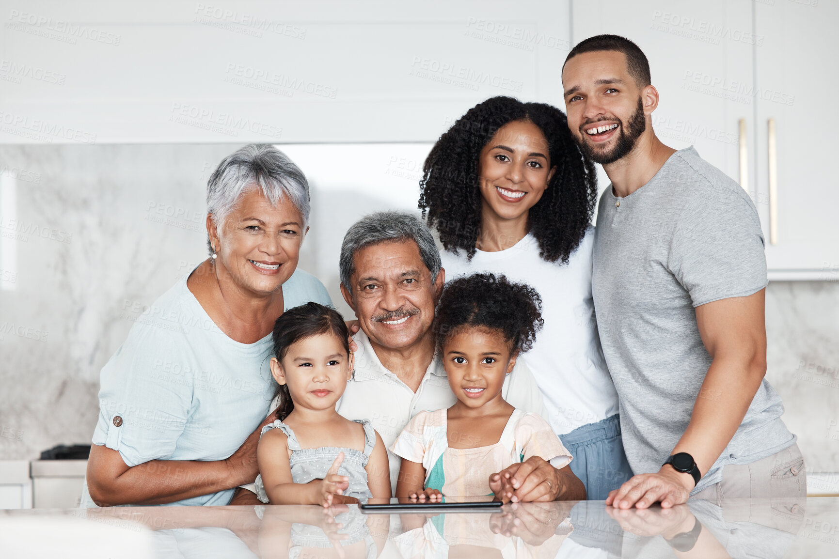 Buy stock photo Big family, portrait and smile in a kitchen with grandparents, children and parents at home. Mom, kids and senior people together with happiness, love and parent care in a house feeling happy