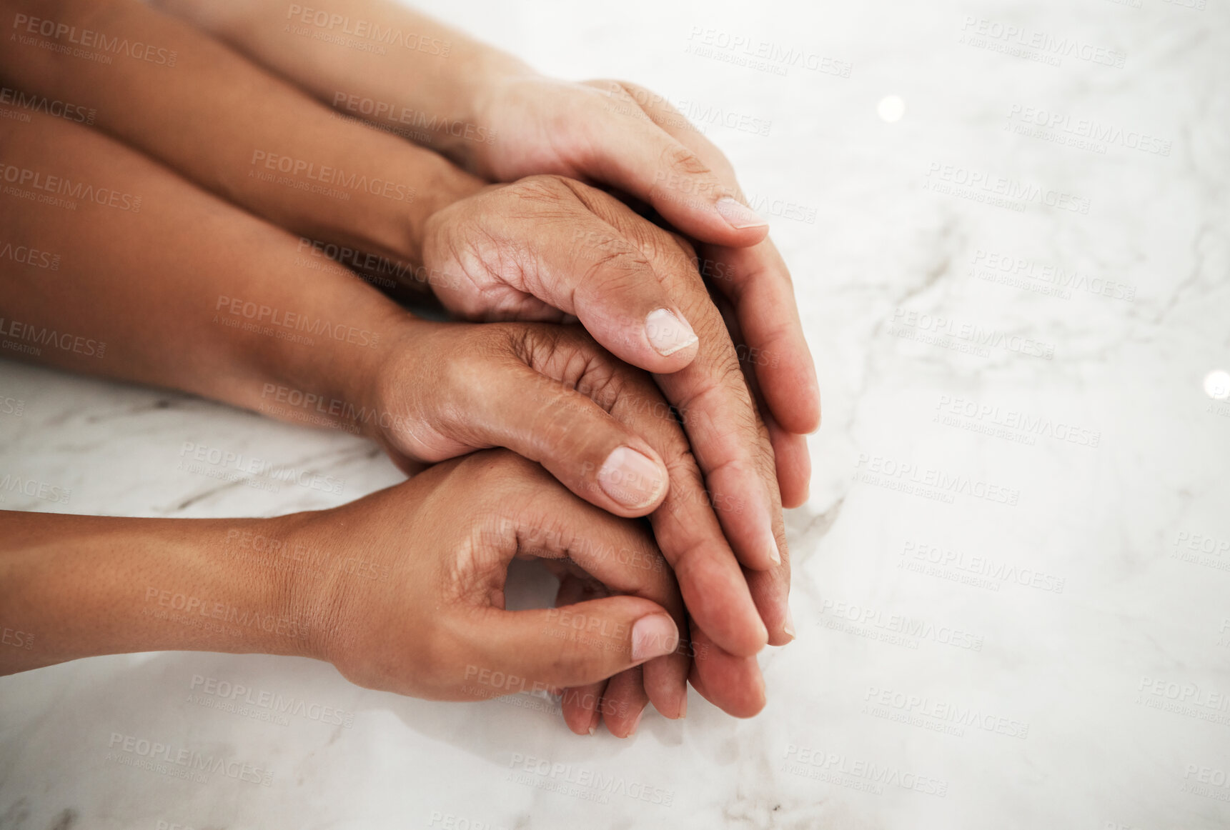 Buy stock photo People, hands and touching in care or support for relationship, generations or family on table. Hand of group embracing love, community or trust in unity together, partnership or trust in solidarity