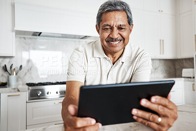 Buy stock photo Mature man, tablet and home on social media, internet and reading online news application. Happy grandpa, digital technology and connection in house for networking, website search and ebook for smile