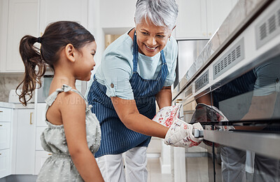 Buy stock photo Learning, cooking and grandmother with girl by oven in kitchen baking delicious meal. Education, development and happy grandma teaching kid how to bake, bonding and enjoying quality time together.