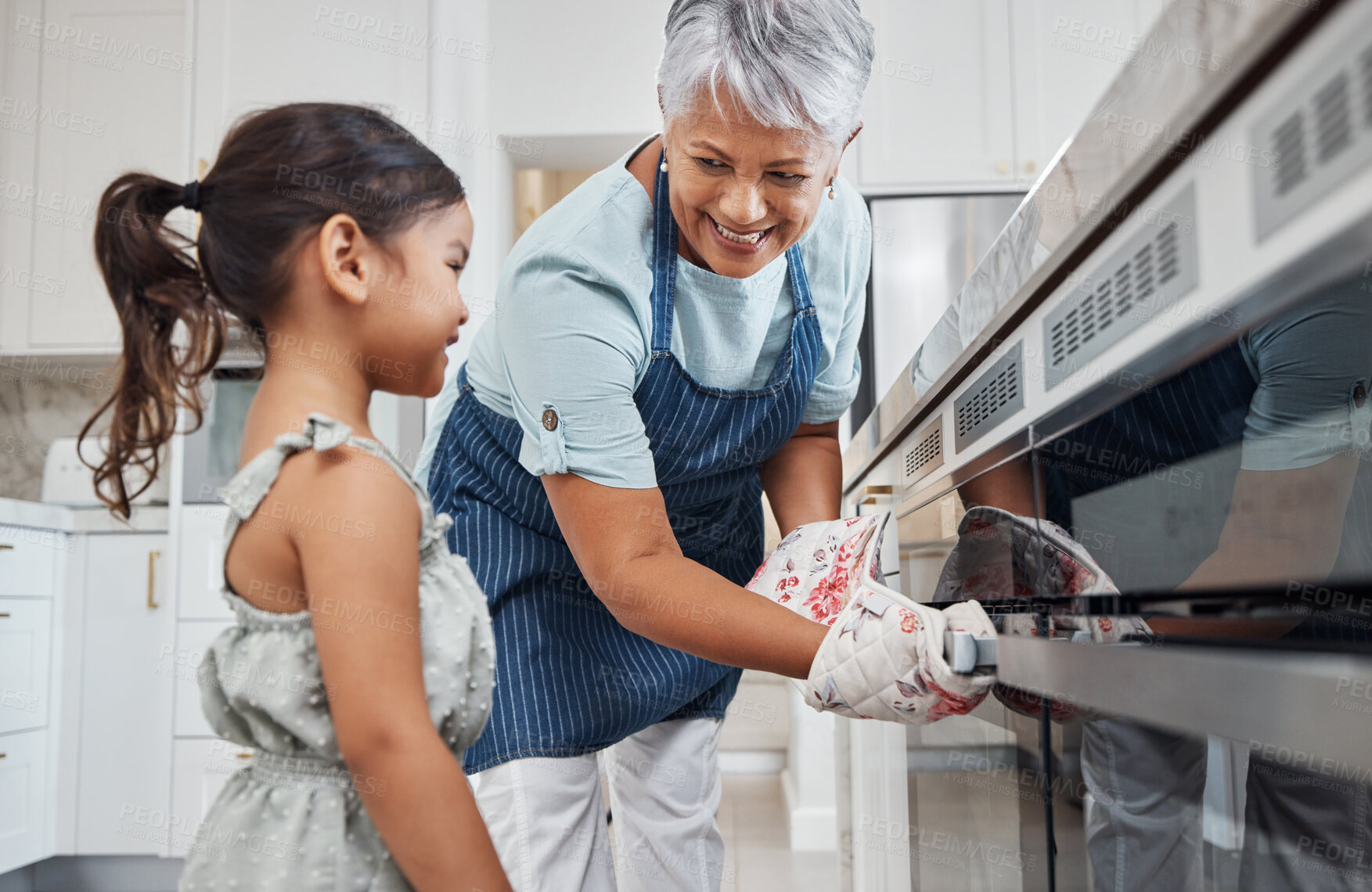 Buy stock photo Learning, cooking and grandmother with girl by oven in kitchen baking delicious meal. Education, development and happy grandma teaching kid how to bake, bonding and enjoying quality time together.