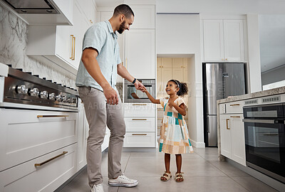 Buy stock photo Family, father and girl dance in kitchen together for bonding, quality time and affection at home. Family, love and happy dad with girl dancing, smile and holding hands for fun, relaxing and carefree