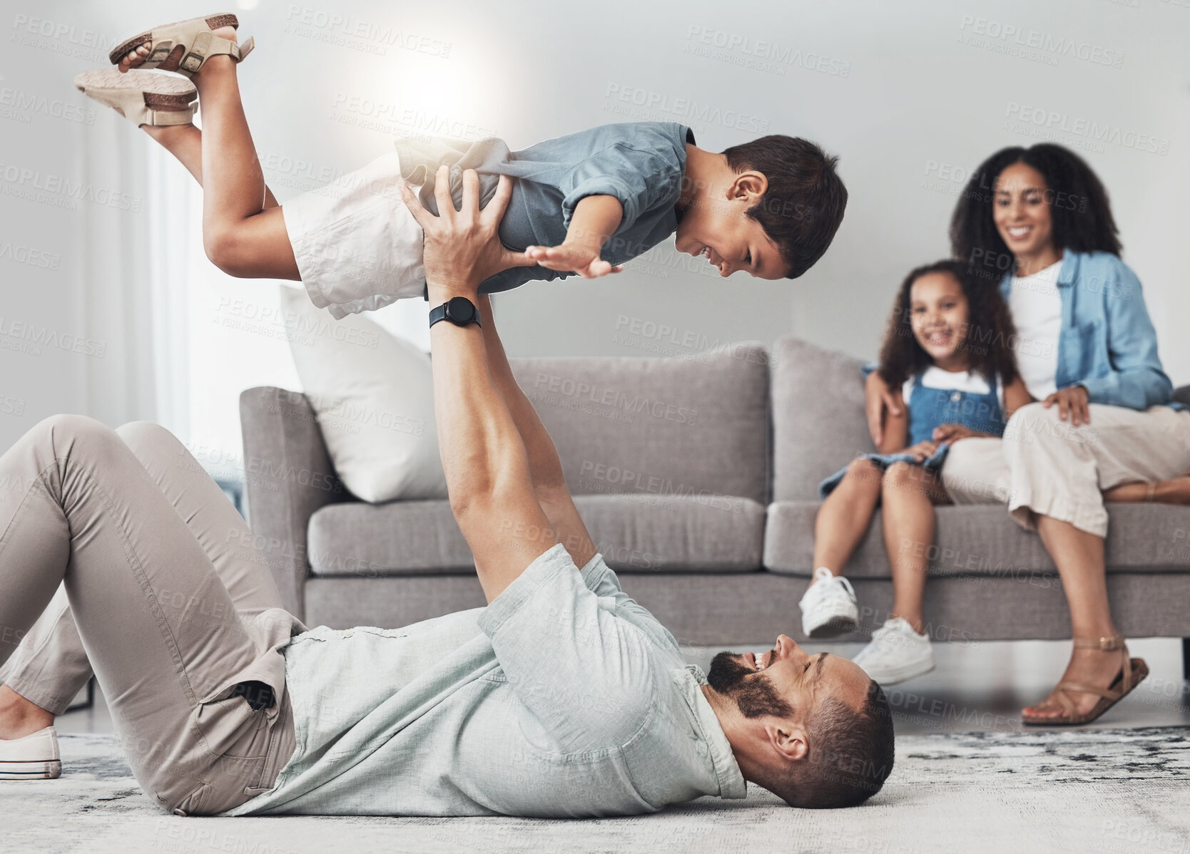 Buy stock photo Relax, happy and airplane with father and son on floor of living room for bonding, playful and support. Wellness, game and strong with dad and child in family home for care, quality time and smile