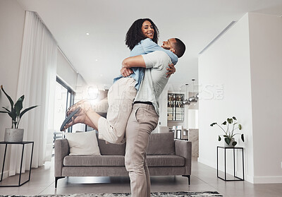 Buy stock photo Love, man pick up woman and in living room for happiness, loving and celebration for relationship. Portrait, couple or male hug female in lounge, joyful or achievement with smile, relax or cheerful