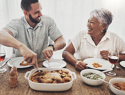 Buy stock photo Love, mother and adult son cut chicken, event and conversation with happiness, family and loving together. Happy, mama and male child with food, smile or enjoy party for quality time or weekend break