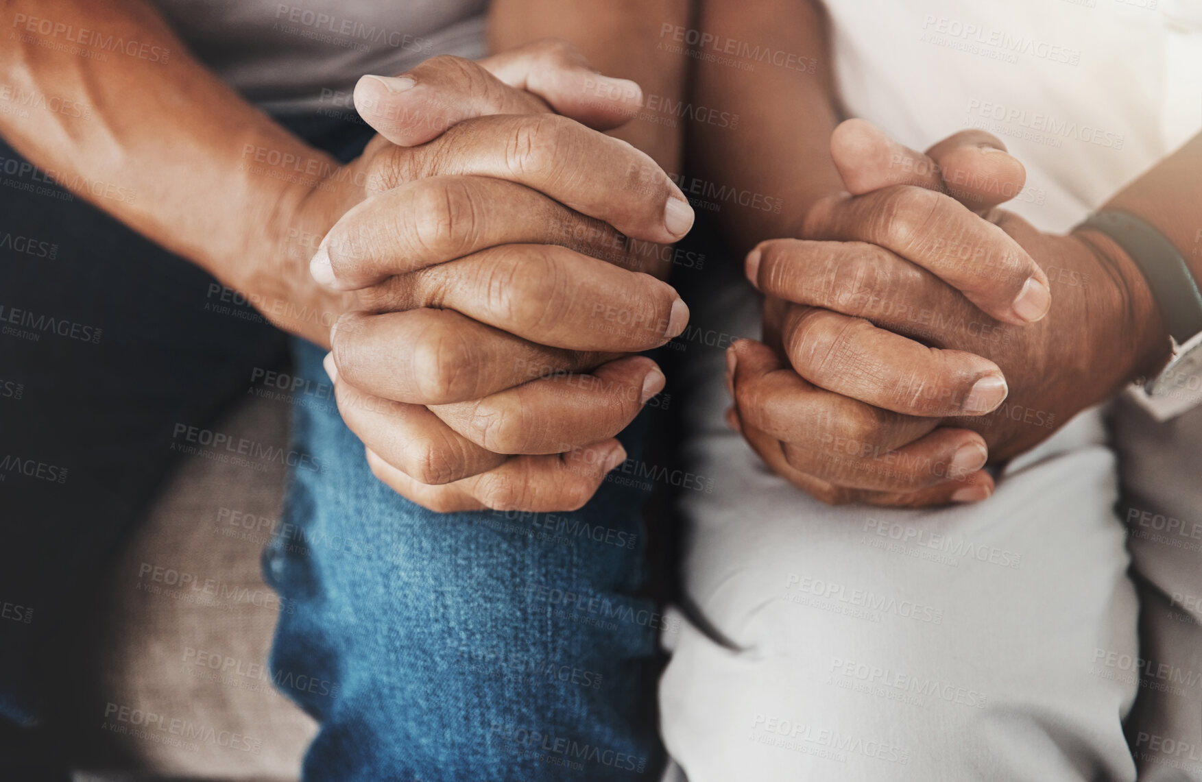 Buy stock photo Senior, hands and couple sitting together for support, relax and bonding in retirement. Hope, insurance and fingers of an elderly man and woman on a couch for marriage, respect and compassion