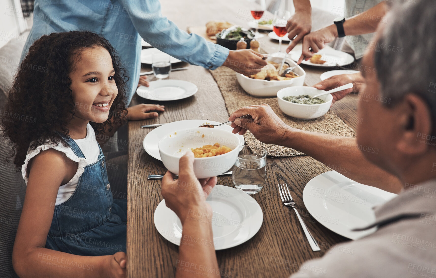 Buy stock photo Food, family and grandfather with child for holiday celebration, Christmas and nutrition. Happy kid with senior man or person with lunch help, love and care in Mexico home and dining room