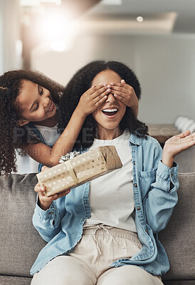 Buy stock photo Mothers day, present and surprise of a child with a gift for mom in a living room. Wow, home and mother on a couch with a girl holding eyes closed with happiness and a smile in a house with box 