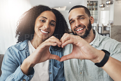 Buy stock photo Love, heart hand sign and portrait couple enjoy quality time together, bonding or relax on home living room sofa. Happiness, emoji gesture or happy marriage people, man or woman in good health
