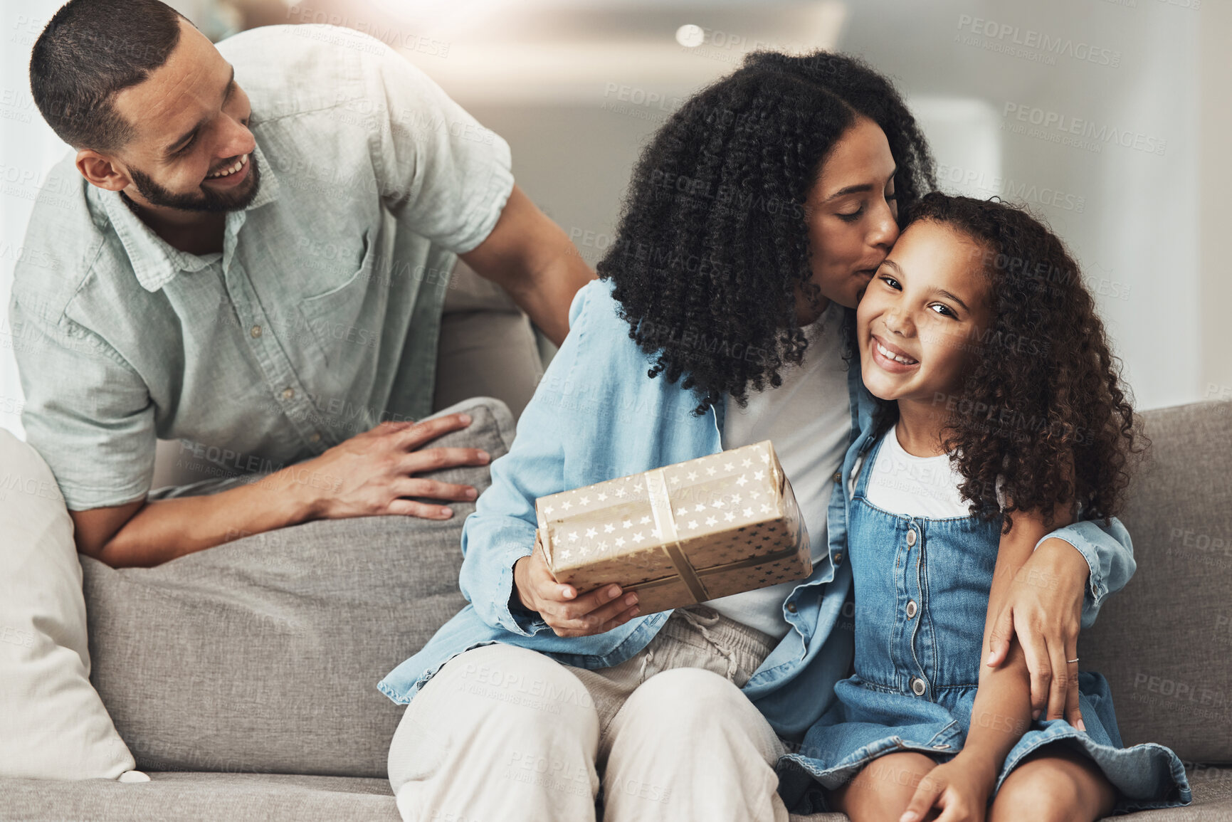 Buy stock photo Birthday, kiss and child with gift from parents to celebrate a special occasion, achievement or event. Affection, gratitude and mom kissing a child while giving a present from dad for celebration