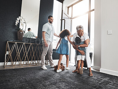 Buy stock photo Family, grandmother and children hug as greeting in a home or house due to grandparent visit on holiday or vacation. Kids, grandchildren and elderly woman embrace feeling excited, happy and happiness