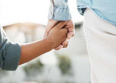 Buy stock photo Love, care and mother and child holding hands in the city for safety, support and trust in Switzerland. Help, compassion and back of a kid and parent walking outdoors with guidance and affection