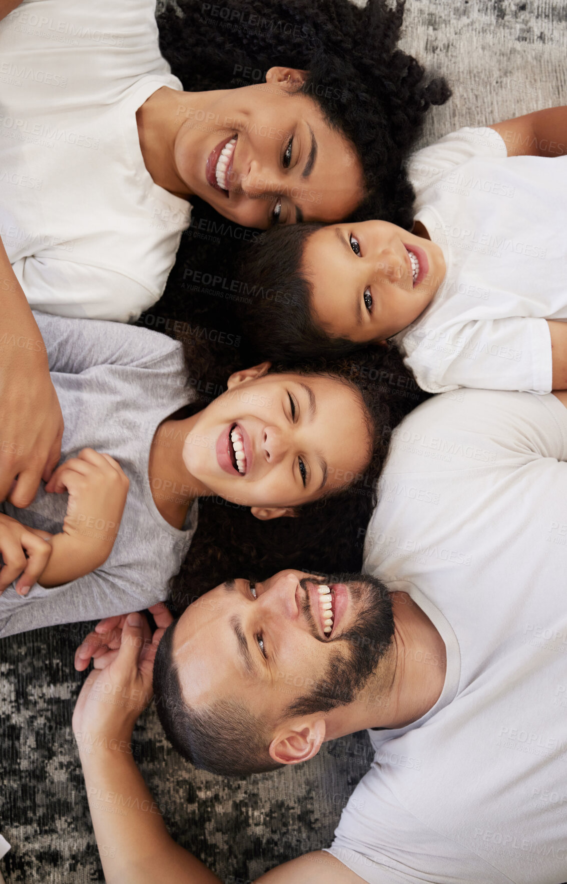 Buy stock photo Above, family and portrait with children and parents on a floor, happy and relax while bonding in their home. Love, mother and kids with father on the ground for fun, laugh and playing in their house