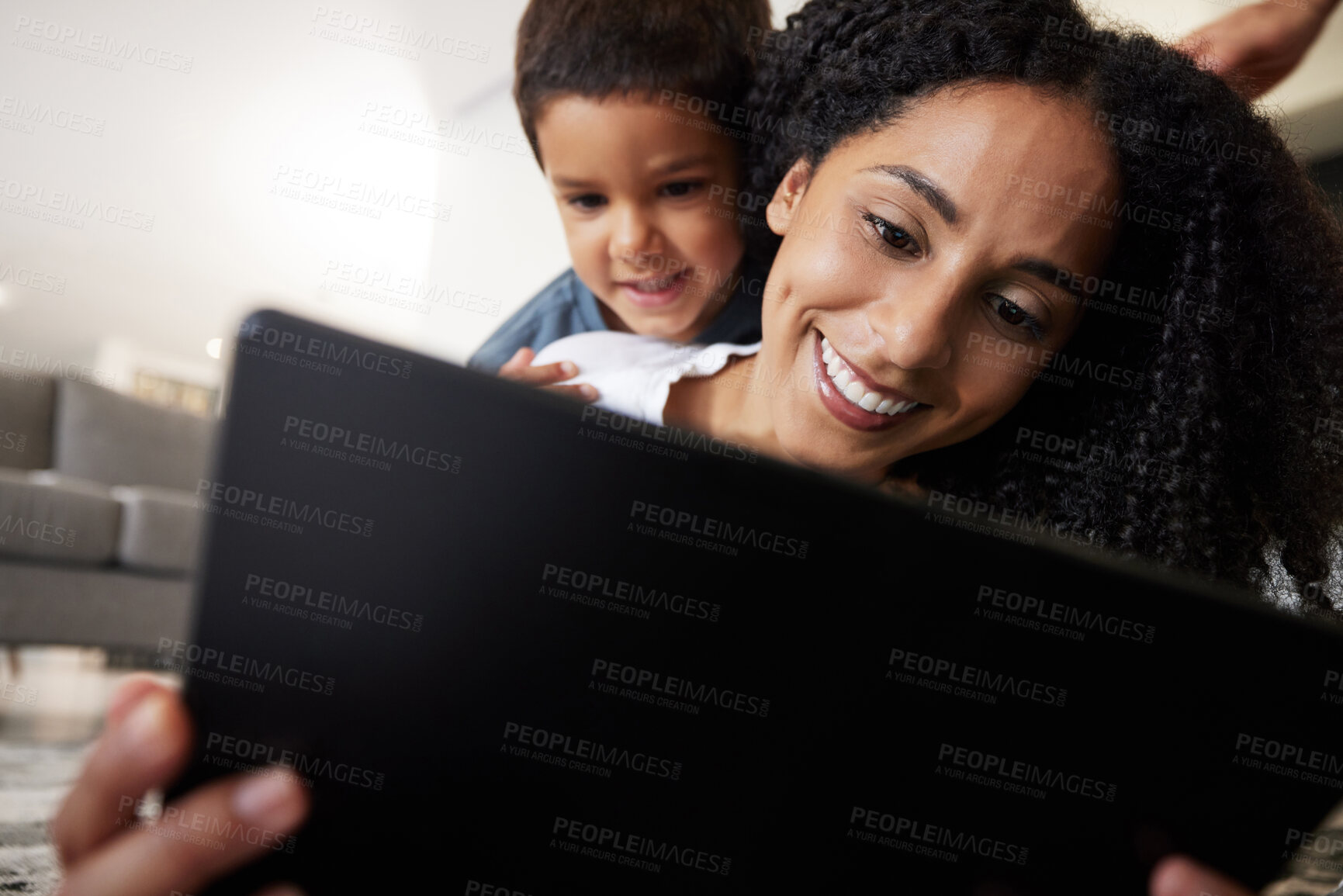 Buy stock photo Love, mother with son on back and on floor with tablet, reading and learning together for quality time. Happy, mama and boy on ground, device and bonding on break, weekend and enjoy online videos