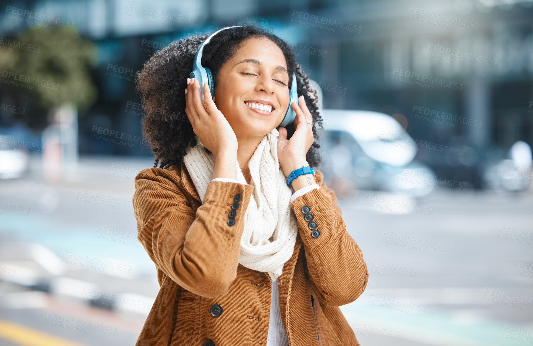 Buy stock photo Black woman, music and headphones while happy in city for travel, motivation and mindset. Young person on urban street with radio and sound while listening and streaming podcast or audio outdoor