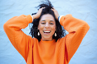 Buy stock photo Black woman, portrait or touching fashion hairstyle on isolated blue background, mockup backdrop or wall mock up. Smile, happy or dancing student in trendy, cool or stylish clothes for youth freedom