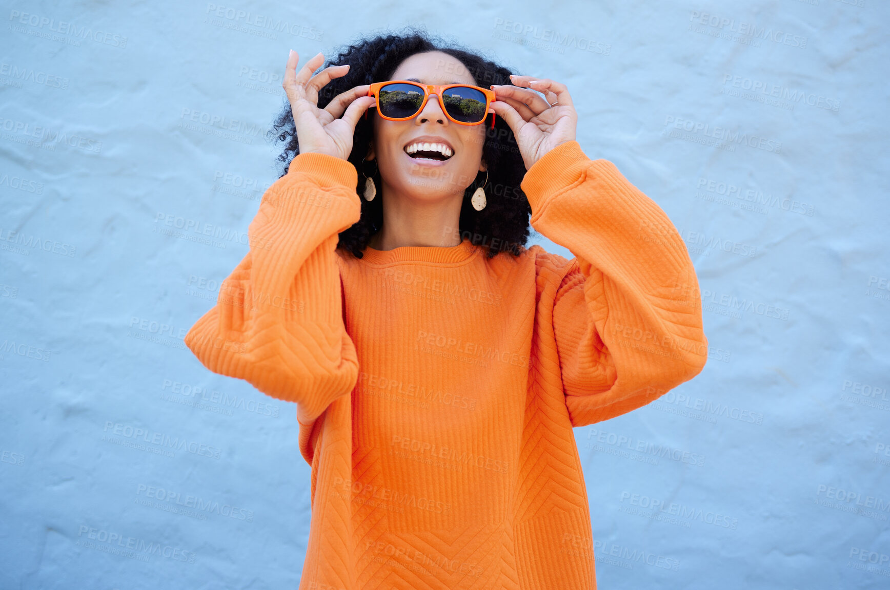 Buy stock photo Fashion, sunglasses and black woman isolated on blue background of gen z, youth or cool trendy clothes. Happy person or beauty model for confidence, vision style and orange color streetwear on mockup