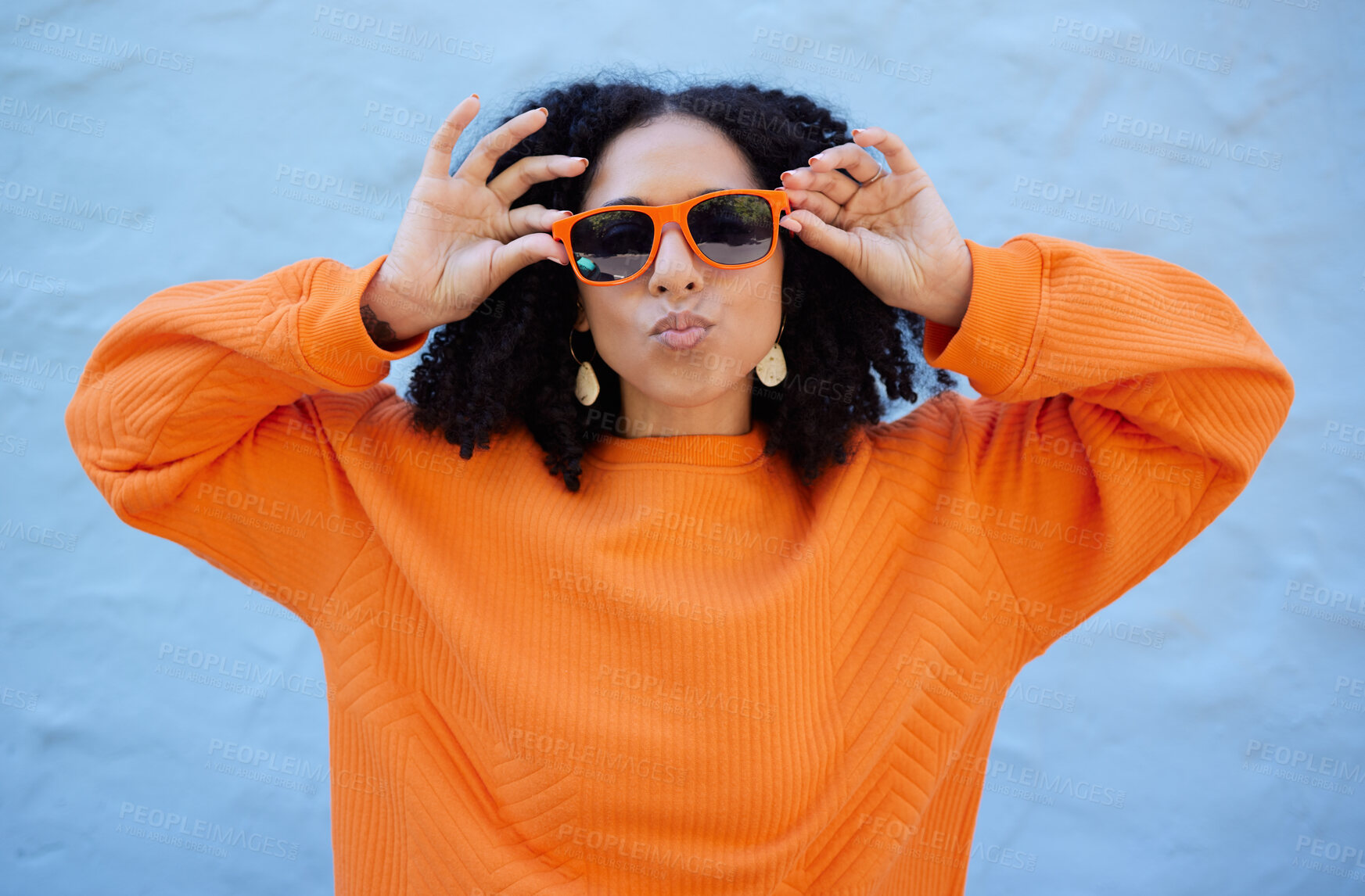 Buy stock photo Fashion, sunglasses and black woman with kiss face, summer style and beauty with hairstyle on blue background. African American model hands with designer brand frame and trendy, stylish and pose