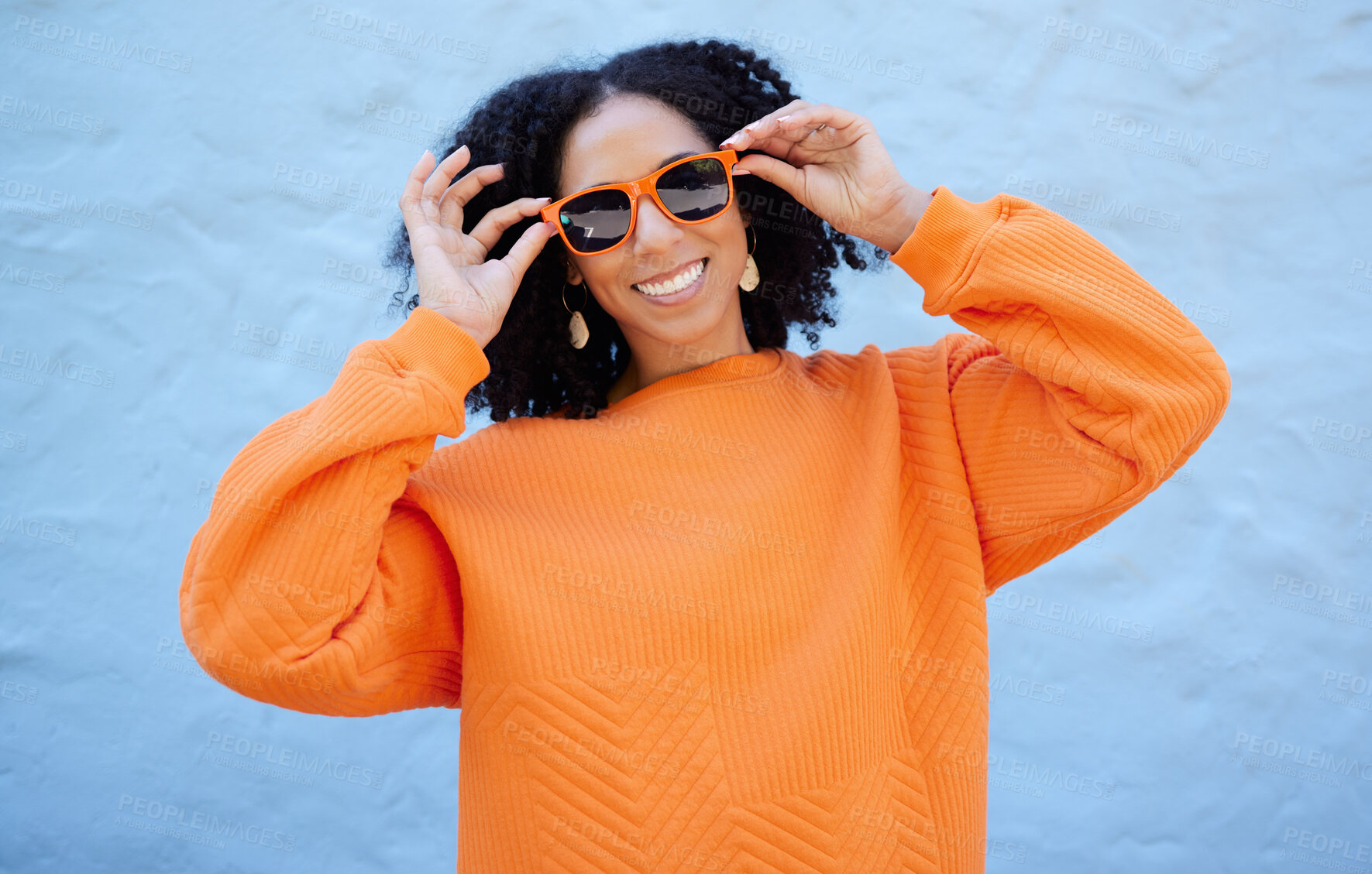 Buy stock photo Fashion portrait, sunglasses and black woman isolated on blue background gen z, youth or trendy clothes. Happy person or beauty model in confidence, vision style and orange color on brick wall mockup