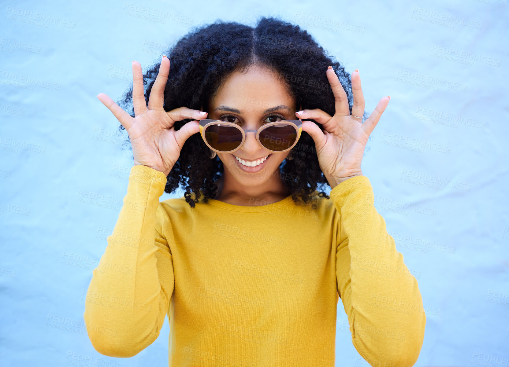 Buy stock photo Trendy sunglasses, portrait and black woman isolated on blue background gen z, youth and fashion clothes. Summer, person or beauty model smile with vision style, yellow color and brick wall mockup