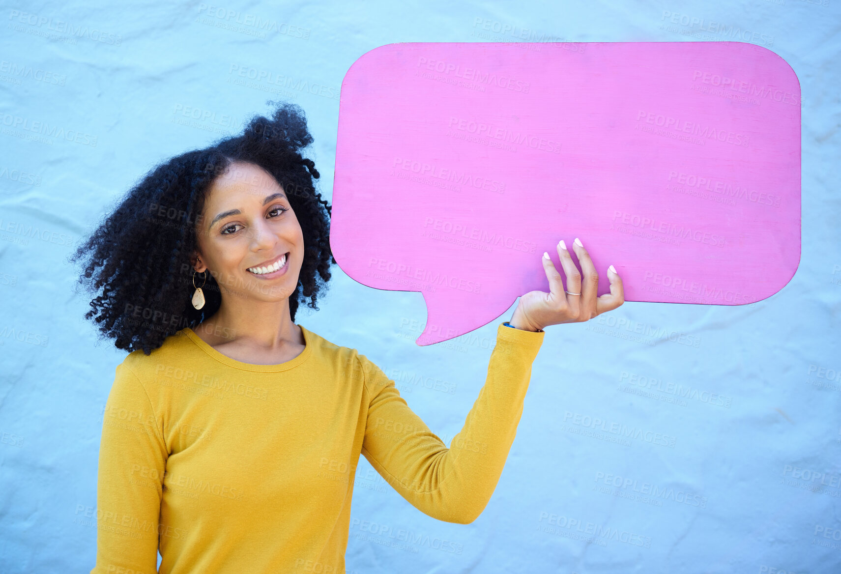 Buy stock photo Speech bubble, black woman and portrait in studio for advertising, mockup and space on blue background. Face, girl and billboard, branding and paper for product placement, marketing and copy space 