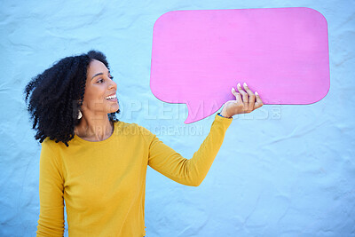 Buy stock photo Communication, black woman and speech bubble for advertising, information or mockup on blue studio background. African American female, lady or poster for logo, happy or brand development on backdrop