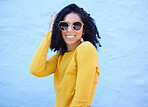 Fashion sunglasses, portrait and black woman on blue background, excited face and trendy cool clothes. Summer, shades and happy girl model smile with vision, yellow color style and urban wall mockup