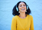 Black woman, portrait or music headphones on isolated blue background, fashion mockup or wall mock up. Smile, happy or laughing student listening to radio, audio and podcast in trendy or cool clothes
