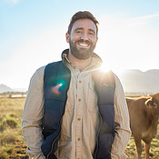 Smile, farming and portrait of man with cow on field, happy farmer in ...