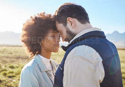 Buy stock photo Intimacy, love and couple in nature on a farm for a romantic anniversary or valentines day date. Intimate, affection and interracial man and woman in a romance moment together on a eco friendly field