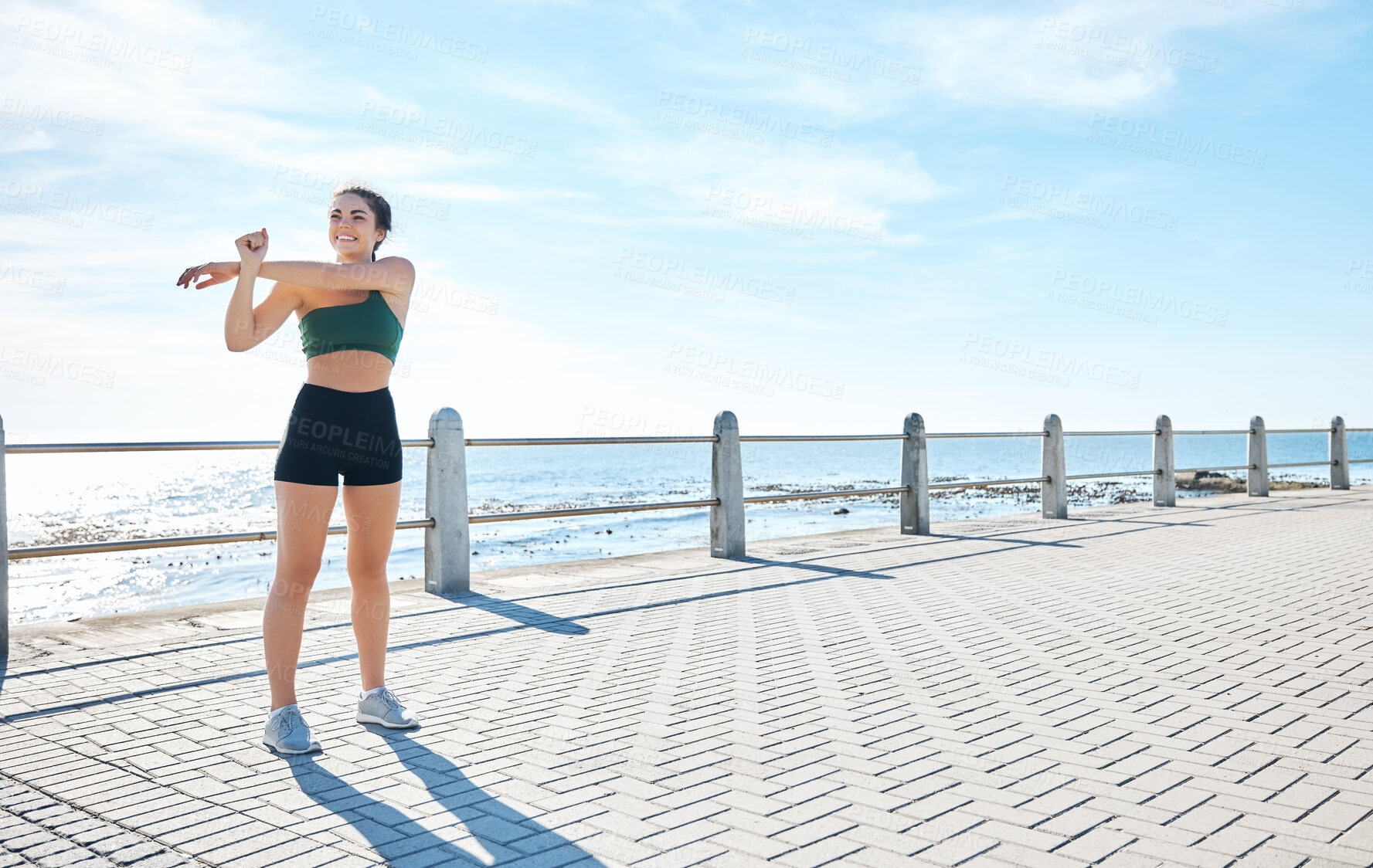 Buy stock photo Fitness, woman and stretching arms at the beach for running, exercise or cardio workout outdoors. Active female runner in warm up arm stretch preparation for run, exercising or training in nature