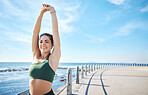 Fitness, woman and stretching arms at the beach for yoga, exercise or cardio workout outdoors. Portrait of happy female runner in warm up arm stretch with smile for exercising or training on mockup