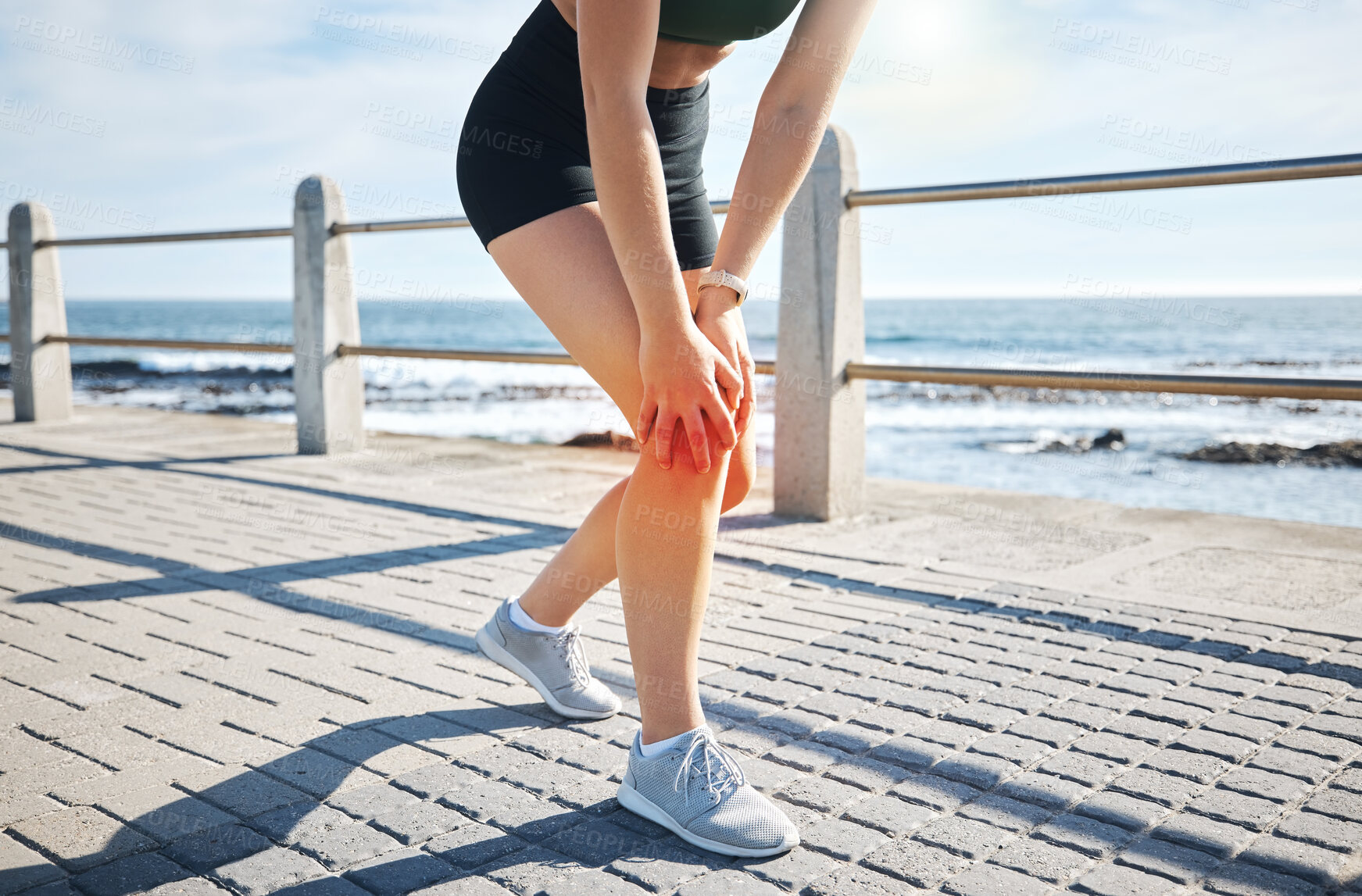 Buy stock photo Sports woman, knee pain or red glow by beach fitness, ocean workout or sea training in healthcare wellness crisis. Legs injury, hurt or body stress for runner with burnout on medical anatomy