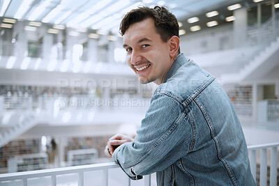 Buy stock photo College, education and portrait of a man in the library for learning, research and reading. Smile, future goals and happy student at university for studying, knowledge and scholarship for school