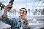 Selfie, university and man student with peace sign for social media update, blog post or live streaming his experience. Education, research and person in campus library with smile for profile picture