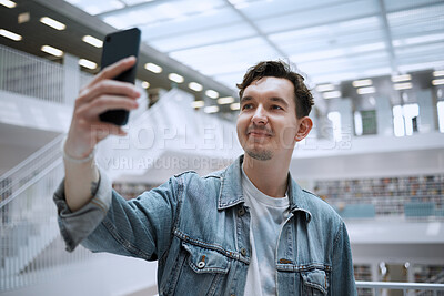 Buy stock photo Selfie, campus and man in library for research update, social media or blog post with live streaming his experience. Education, study and phd person in university with smile for profile picture