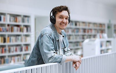 Buy stock photo Headphones, library and student portrait for university, college or campus listening to music in study education. Research, learning and bookshelf with happy person or man on audio technology podcast